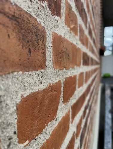 Facaderenovering på Amager med omfugning af murværk på facade.